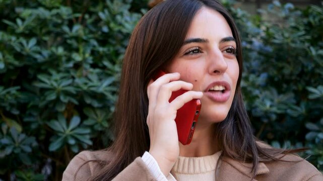  Empowered Young Woman Talking on Phone in City Street