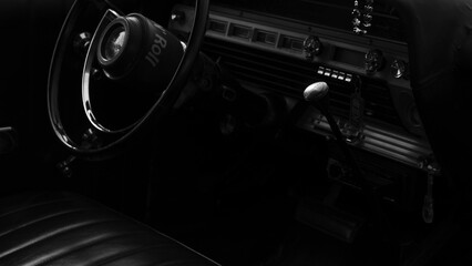 Black and white photo of vintage car interior..