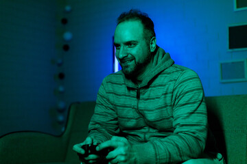 Gamer enjoying a late-night session in a dimly lit room