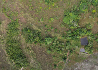 Wetland field panorama with water reservoirs for irrigation Aerial top down view