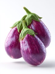 A bunch of purple eggplants with green stems