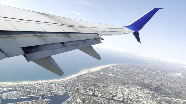 View from the airplane flying over Newport Beach, California, and the Pacific Ocean.
