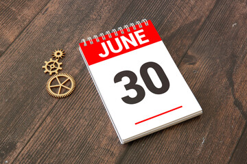 June 30th.June 30 white wooden calendar on vintage wood abstract background.