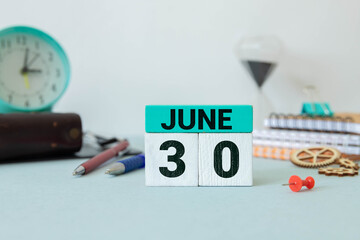 June 30th.June 30 white wooden calendar on vintage wood abstract background.