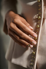 Fashion Elegance: Closeup Hands Nails Jewelry Polish Neutral Skin Portrait Female Touch Luxury Design Trendy Couture Satin Gold Clothing Finger Artistic Chic Sleek Modern Photography