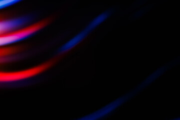 Vibrant abstract light streaks in red and blue on a black background, creating a dynamic and futuristic visual effect. Perfect for modern and creative design projects.