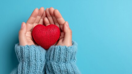 Hands Holding Knitted Heart Symbolizing Care