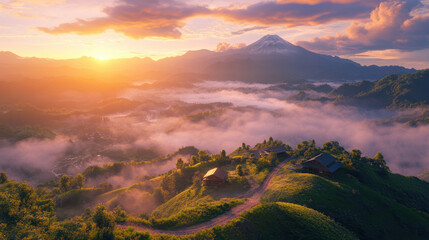 Sunrise over misty mountain valley with hillside cabins and winding path