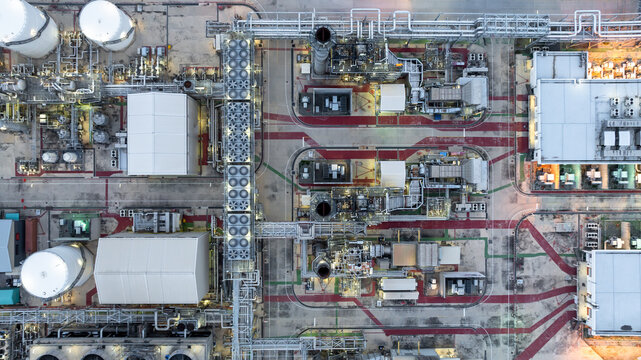Aerial view energy production facility cogeneration power plant industrial, Industrial energy infrastructure, Power plant oil refinery industrial, Power plant pipeline and cooling system oil refinery.