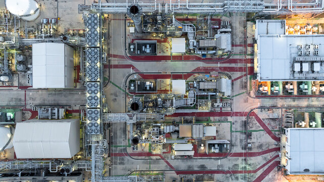 Aerial view energy production facility cogeneration power plant industrial, Industrial energy infrastructure, Power plant oil refinery industrial, Power plant pipeline and cooling system oil refinery.