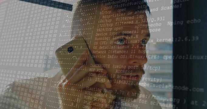 Mid male IT holding smartphone to ear while reviewing growing network scan overlay windowside