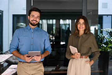2 sales managers, company agents, consultancy professionals, entrepreneurs with devices posing for...