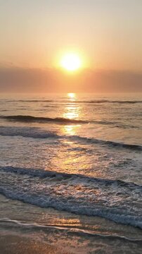 Florianopolis in Santa Catarina during a wonderful sunrise. Mo&ccedil;ambique Beach in aerial view, vertical video.