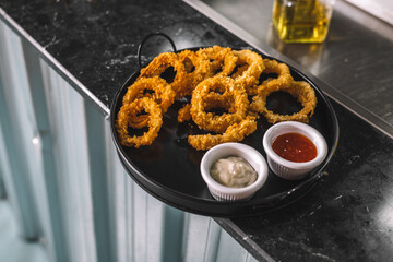 Classic Fast Food Snack – Onion Rings on Plate.jpg, Classic Fast Food Snack – Onion Rings on Plate-Fried Onion Rings with Dipping Sauce