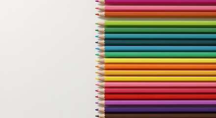 Obraz premium Vibrant Colored Pencils Arranged on White Background Perfect for Art and Creativity