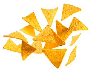 Crispy tortilla chips scattered on a surface.
