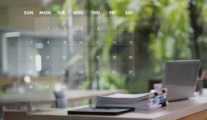 2025 calendar desk with laptop, stack of papers, and calendar overlay showing days of week and dates, bright office or home workspace with