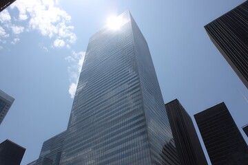 Obraz premium Skyscrapers piercing bright sunny sky above