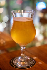 Glass of beer on the wooden table