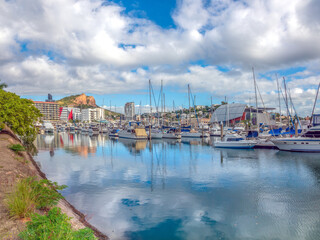 The leisure boat marina of Townsville with the CBD skyline and the iconic Castle Hill in the background, Queensland, Australia