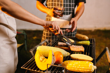 A cheerful summer barbecue gathering with friends and family grilling meat outdoors, enjoying food, laughter, and togetherness in a sunny garden.