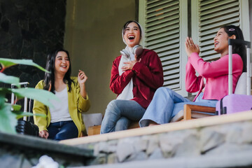 Enthusiastic female friends enjoying shared laughter and camarad