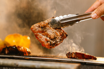 A cheerful summer barbecue gathering with friends and family grilling meat outdoors, enjoying food, laughter, and togetherness in a sunny garden.