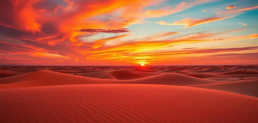 Fototapete Fiery hues paint the desert sky as the sun dips below the horizon, casting long shadows across the sand dunes,  yellow,  landscape © Boonyapawn