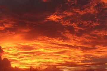 Fototapeta premium Fiery Evening Sky Paints a Crimson Hue