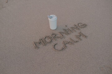Morning Calm – Handwritten Message on Volcanic Sand with Thermos Mug