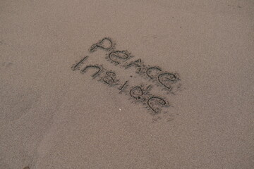 Peace Inside – Handwritten Message on Volcanic Sand