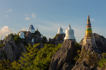Wat Chaloem Phrakiat Phra Chom Klao Rachanusorn. This temple has small white pagodas lined up on the top of the mountain. It is also the site of the Buddha's footprint in Chae Hom District, Lampang
