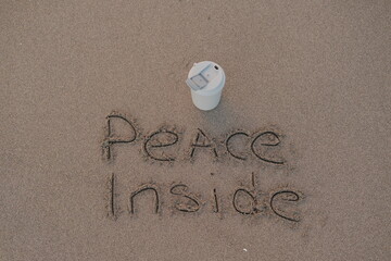 Peace Inside – Handwritten Message on Volcanic Sand with Thermos Mug