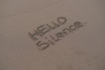 Hello Silence – Handwritten Message on Volcanic Sand