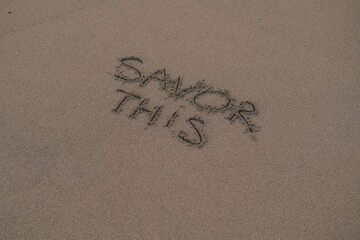 Savor This – Handwritten Message on Volcanic Sand