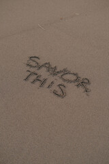 Savor This – Handwritten Message on Volcanic Sand