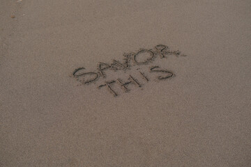 Savor This – Handwritten Message on Volcanic Sand