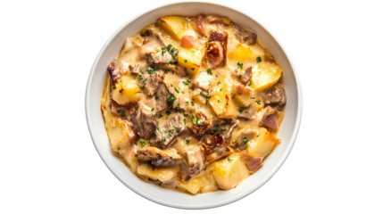 Overhead shot of a white bowl filled with potato beef stew garnished with fresh herbs on  isolated on transparent background