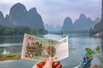 Landscape of Li River famous scenery in Guilin,Yangshuo on RMB 20 yuan currency bank note with Li River on background, China