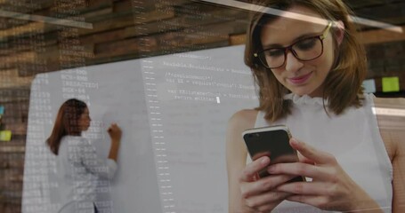Coworkers scrolling smartphone and writing whiteboard in tech office, causing code overlay emerging - Powered by Adobe