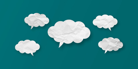 White speech bubble crumpled paper isolated on green background