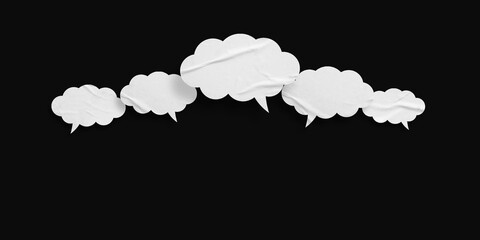 White crumpled speech bubbles isolated on black background.