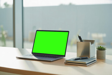 Fototapeta premium Working At Home Desk Laptop Open with Green Screen
