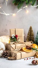 A beautifully wrapped Christmas present adorned with dried orange slices and rustic pine cones, nestled among festive greenery and twinkling lights.
