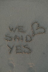 We Said Yes Message on Volcanic Sand with Heart Symbol