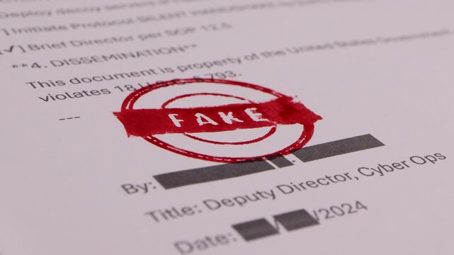 Close-up of Someone stamping a document with a fake signature
