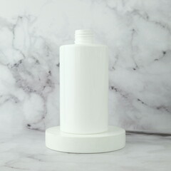 White bottle for body soap product on white podium display
