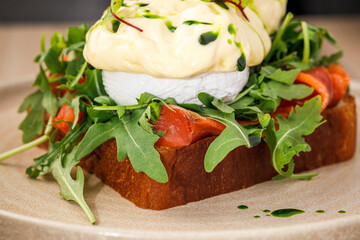 Delicious brunch featuring poached egg and arugula