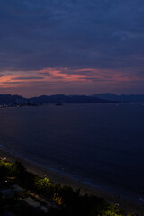 vertical photo of the pink sunset over the sea