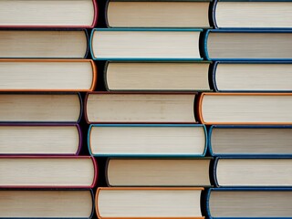 Fototapeta premium Stacked Books Displaying Diverse Colors and Knowledge